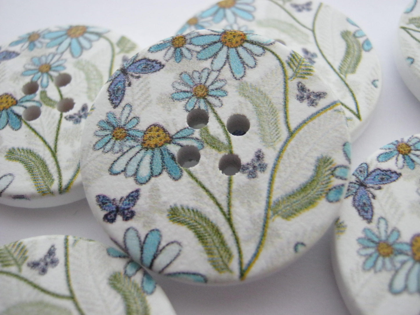 Large blue wild flower wood buttons measuring 30mm (1 1/4")